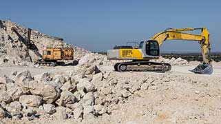 Front End Loader and Excavator Working in Gravel